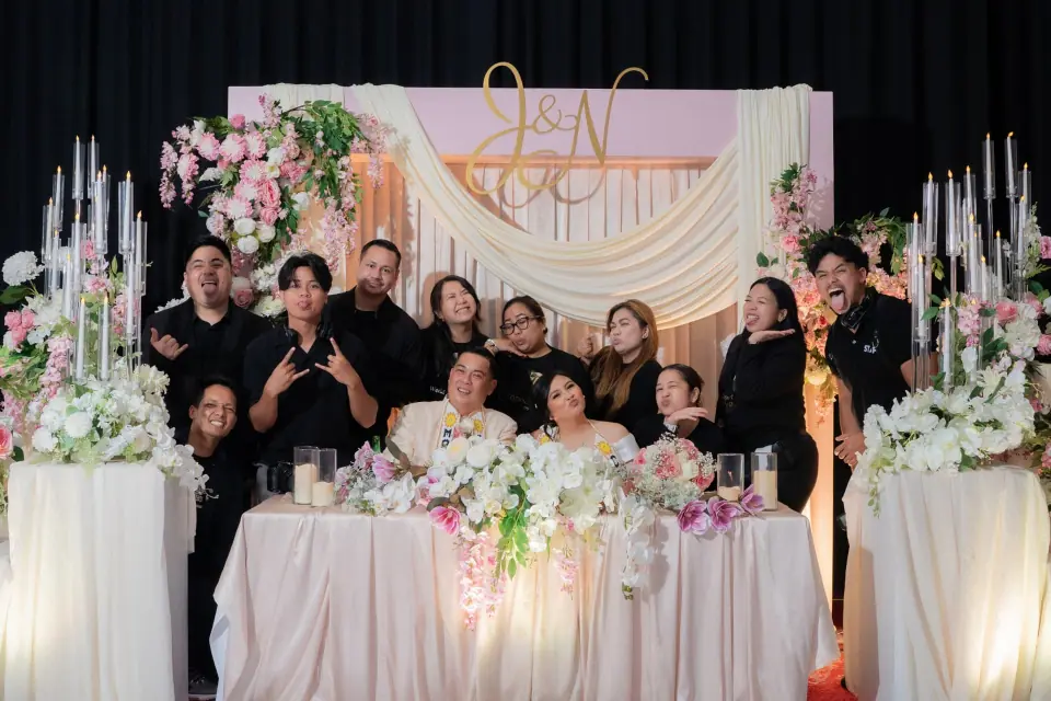 Stel Star team sharing a lighthearted moment with a newlywed couple