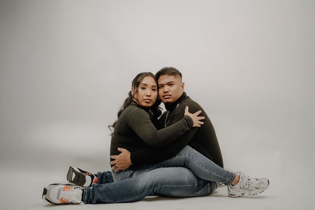 Creative seated couple portrait in the Stel Star studio
