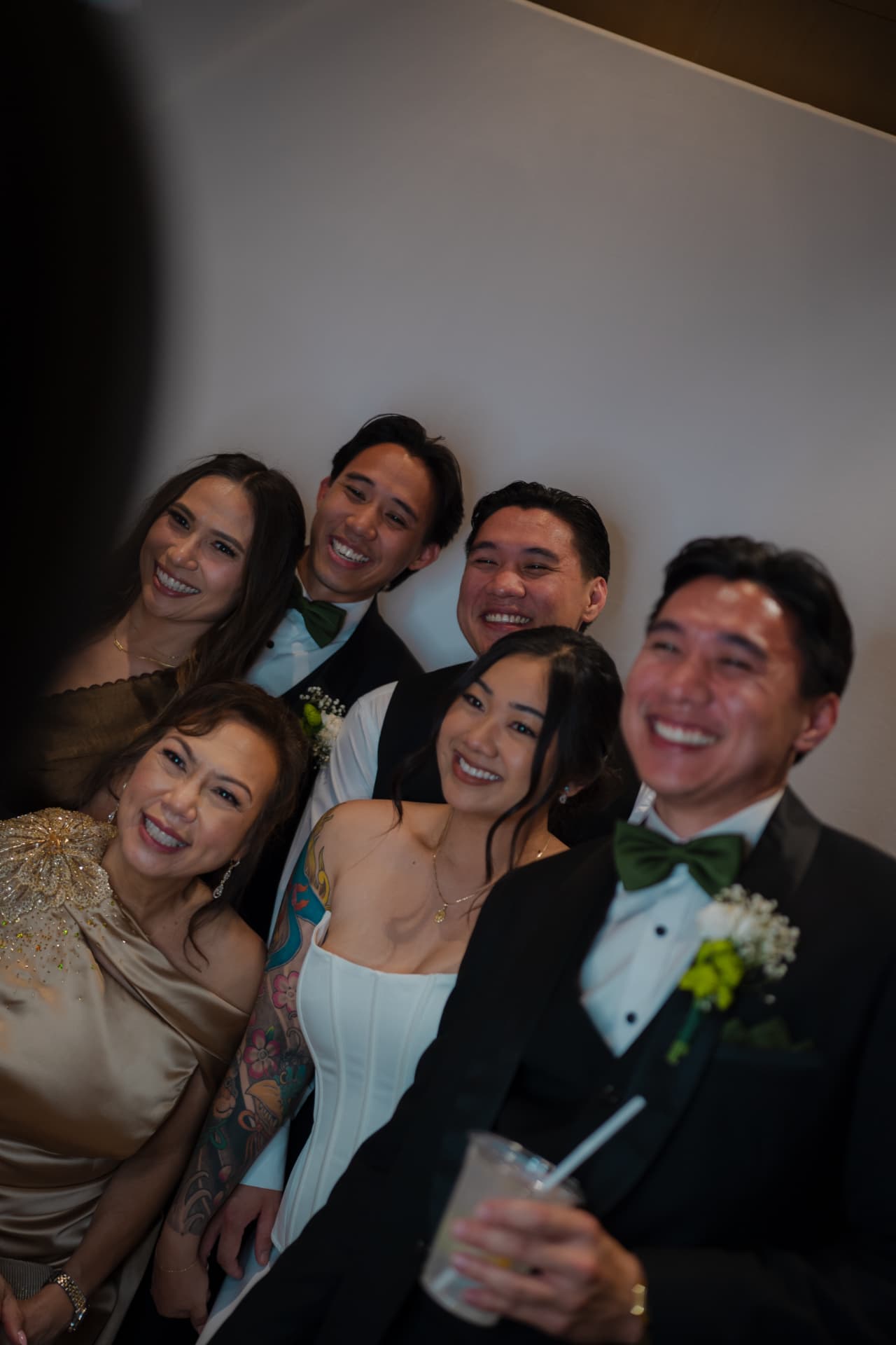 Family laughing together in the photobooth
