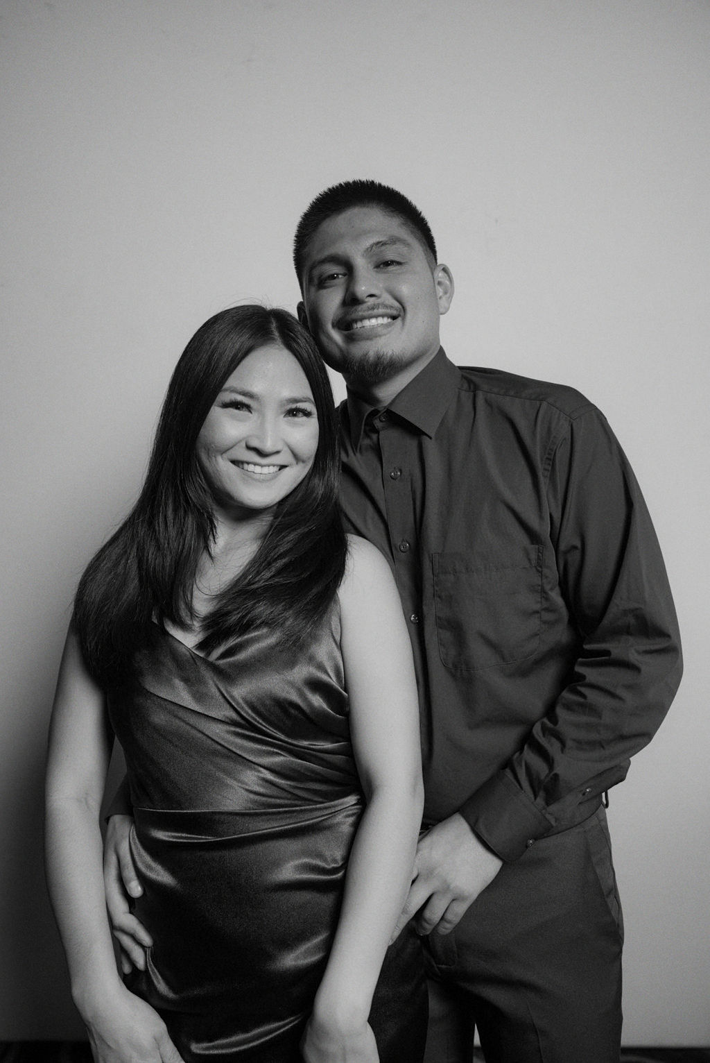 Couple embracing during a black and white portrait booth session