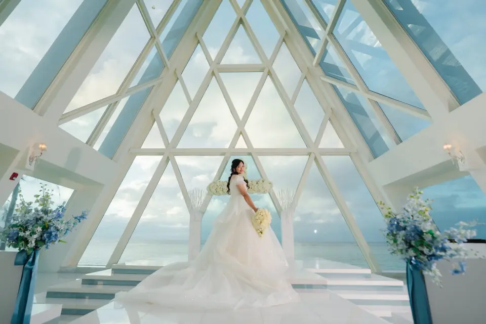 Bride in a glass chapel over Tumon Bay