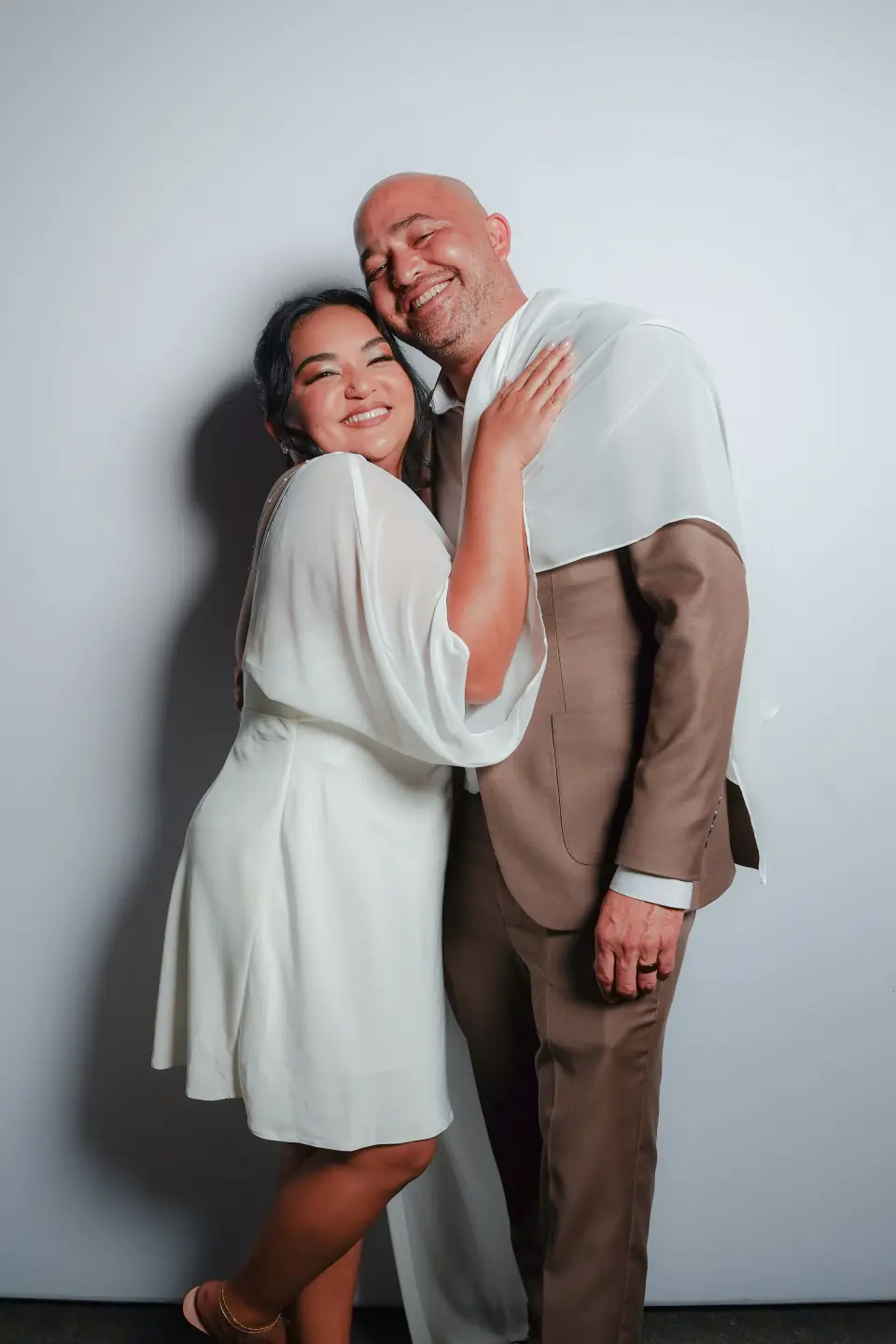 Bride and groom embracing in the Stel Star portrait booth