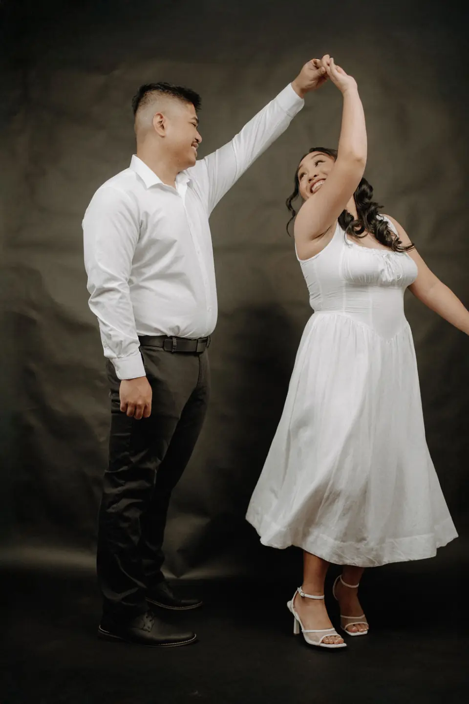 Couple dancing during their engagement portrait session