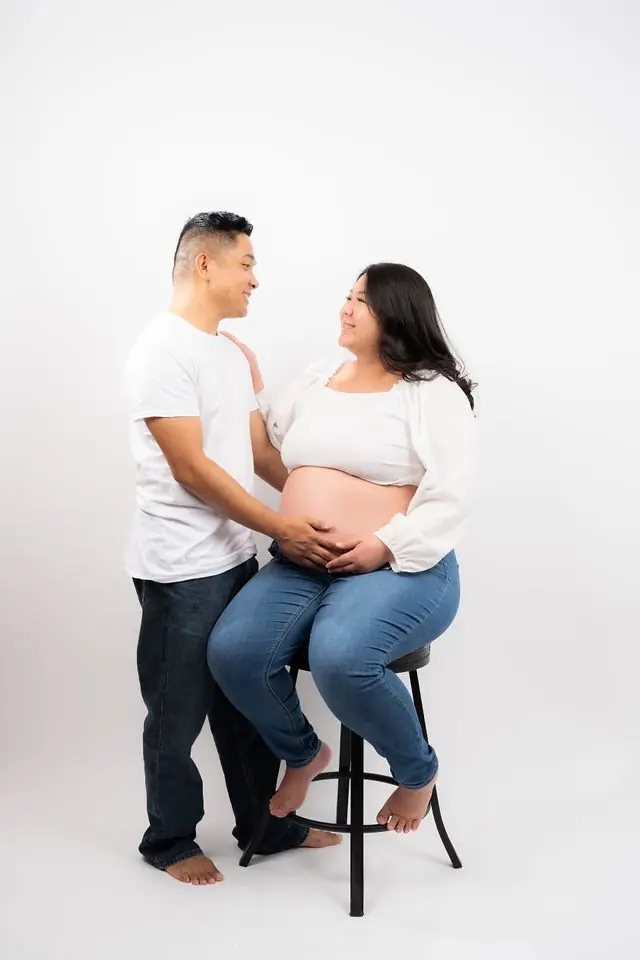 Expecting parents sharing a quiet moment in the studio